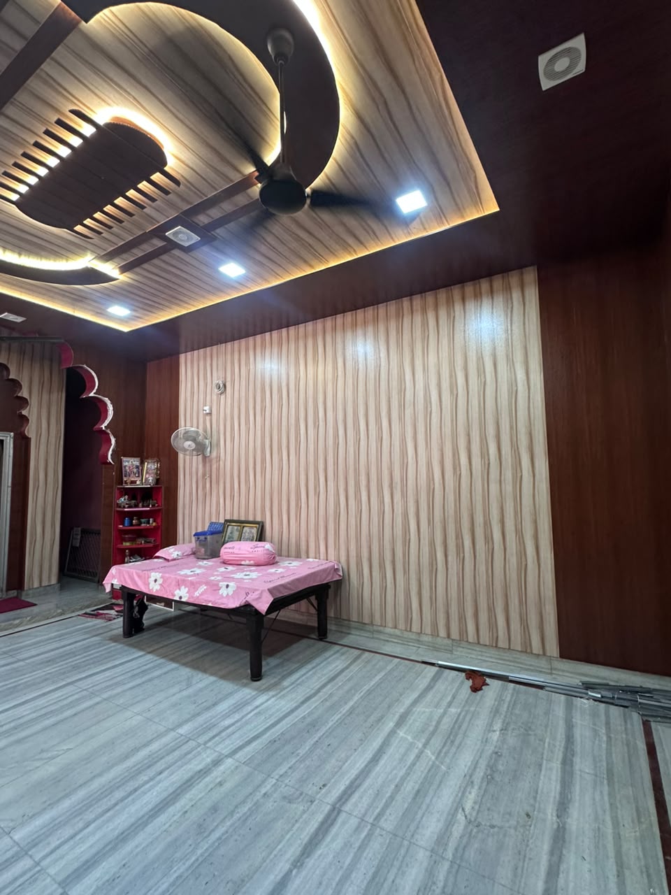 PVC false ceiling with cove lights and fluted wall cladding