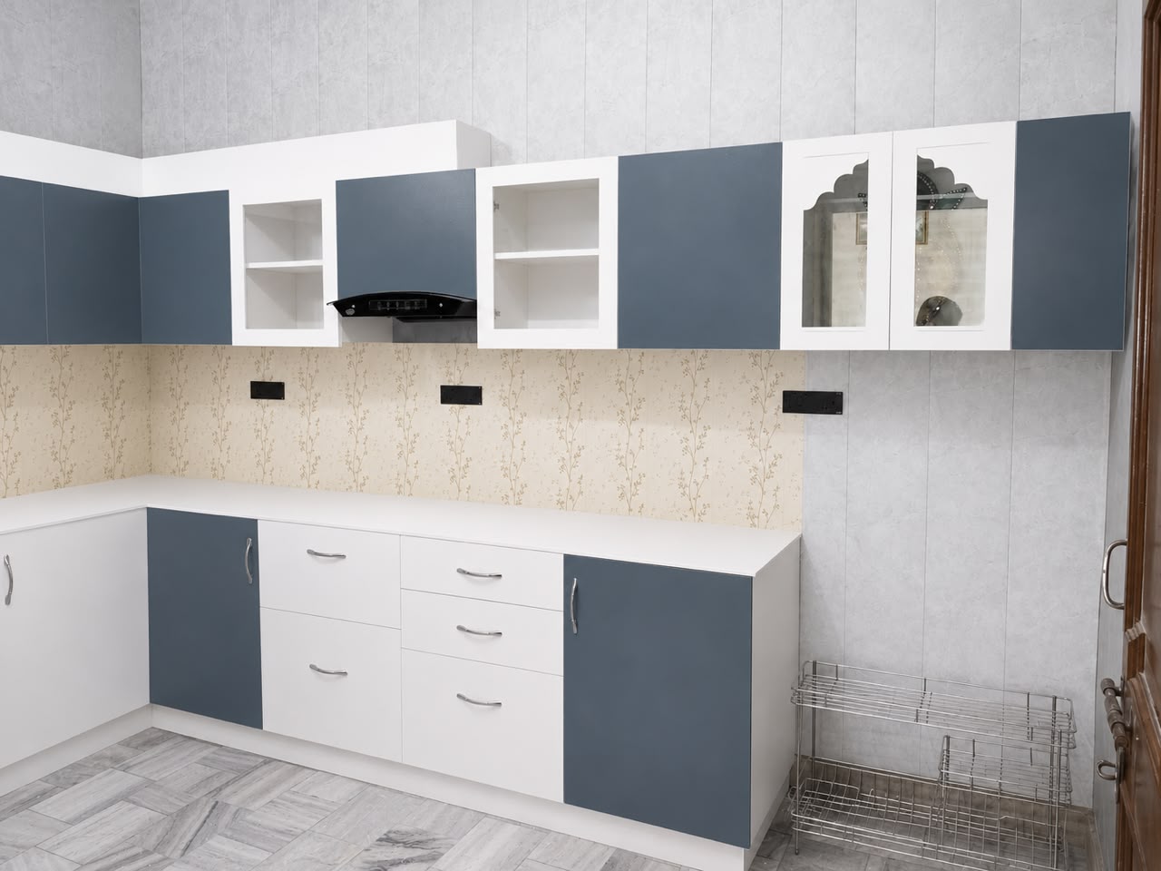 Slate blue kitchen with mandir arch glass unit
